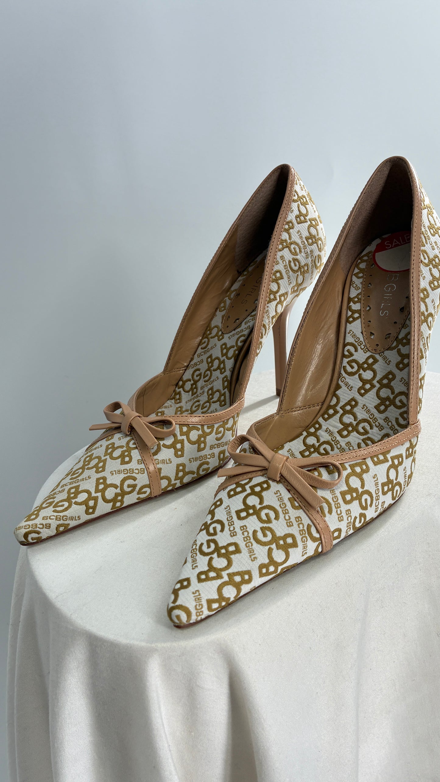Vintage BCBG All Over Monogram Pointed Toe Heels with Leather Bows and Piping (5.5)