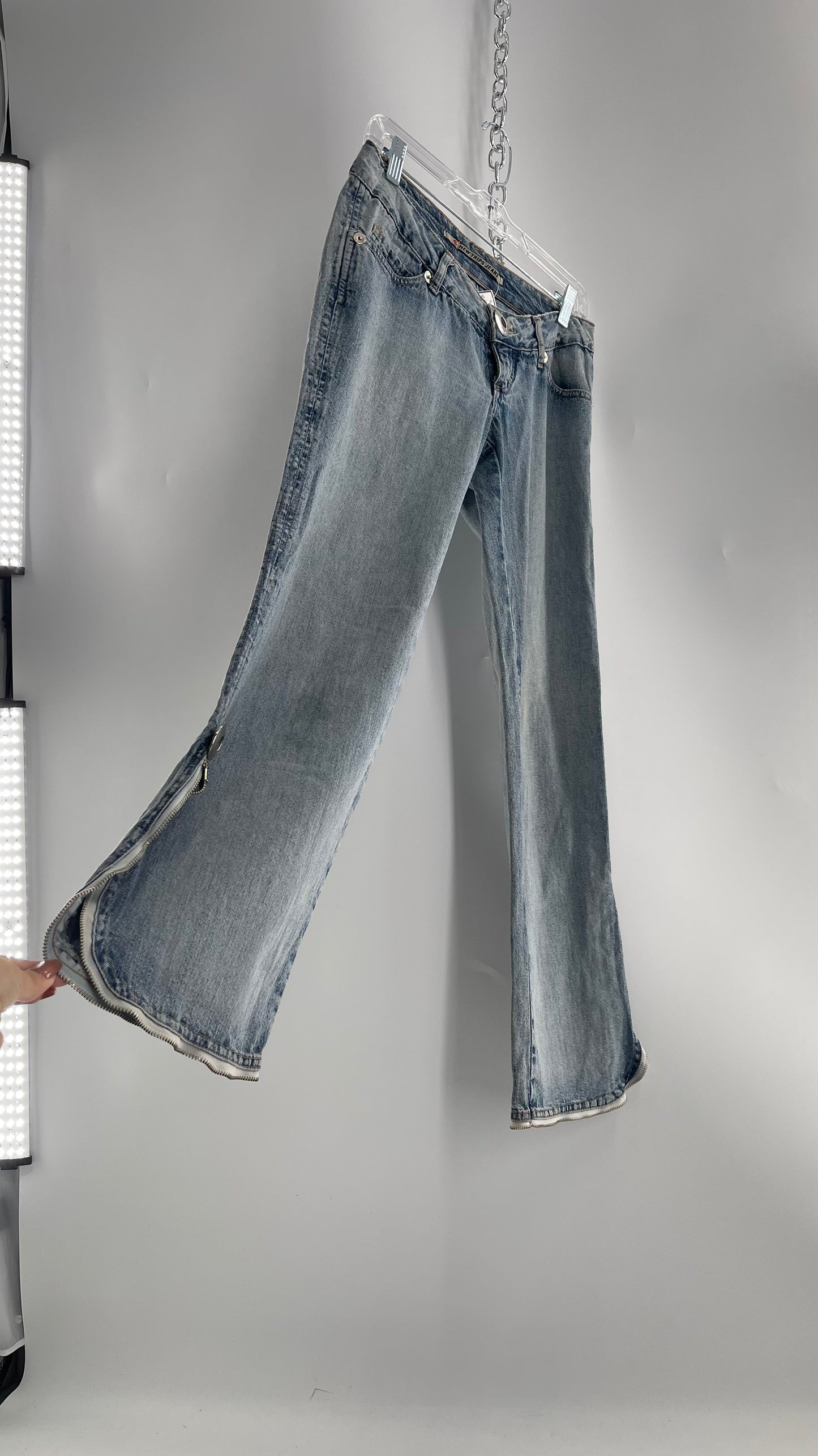 Vintage New Trips Light Wash Kick Flare Jeans with Zipper Hem Detail, V Waistline and Oversized Metal Buttons (40)