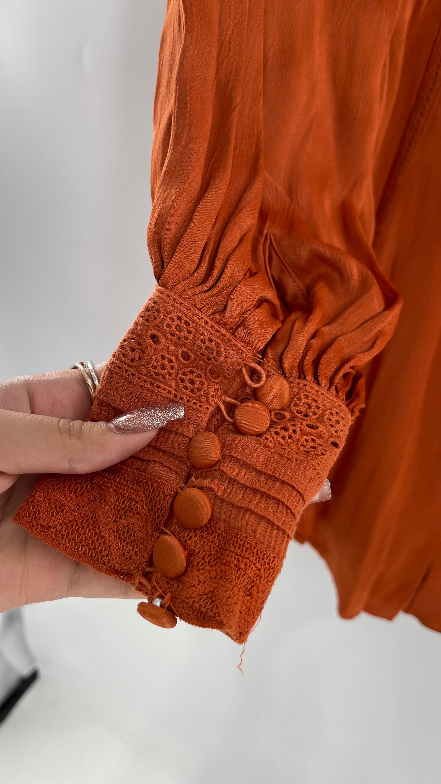 Free People Silky Orange Romper with Buttoned Sleeve Cuffs, Balloon Sleeves and Pleated Lace Bust (2)