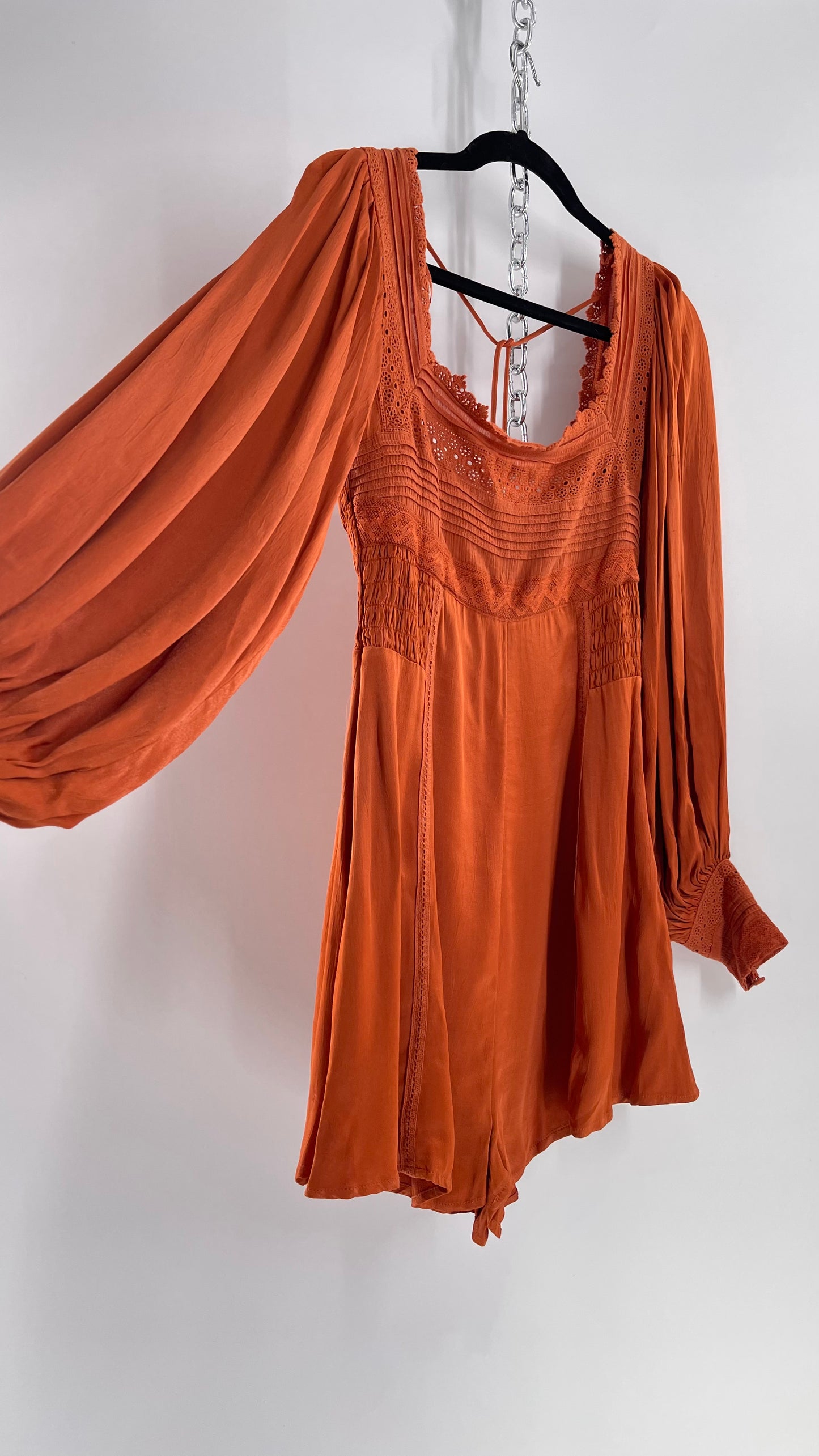 Free People Silky Orange Romper with Buttoned Sleeve Cuffs, Balloon Sleeves and Pleated Lace Bust (2)