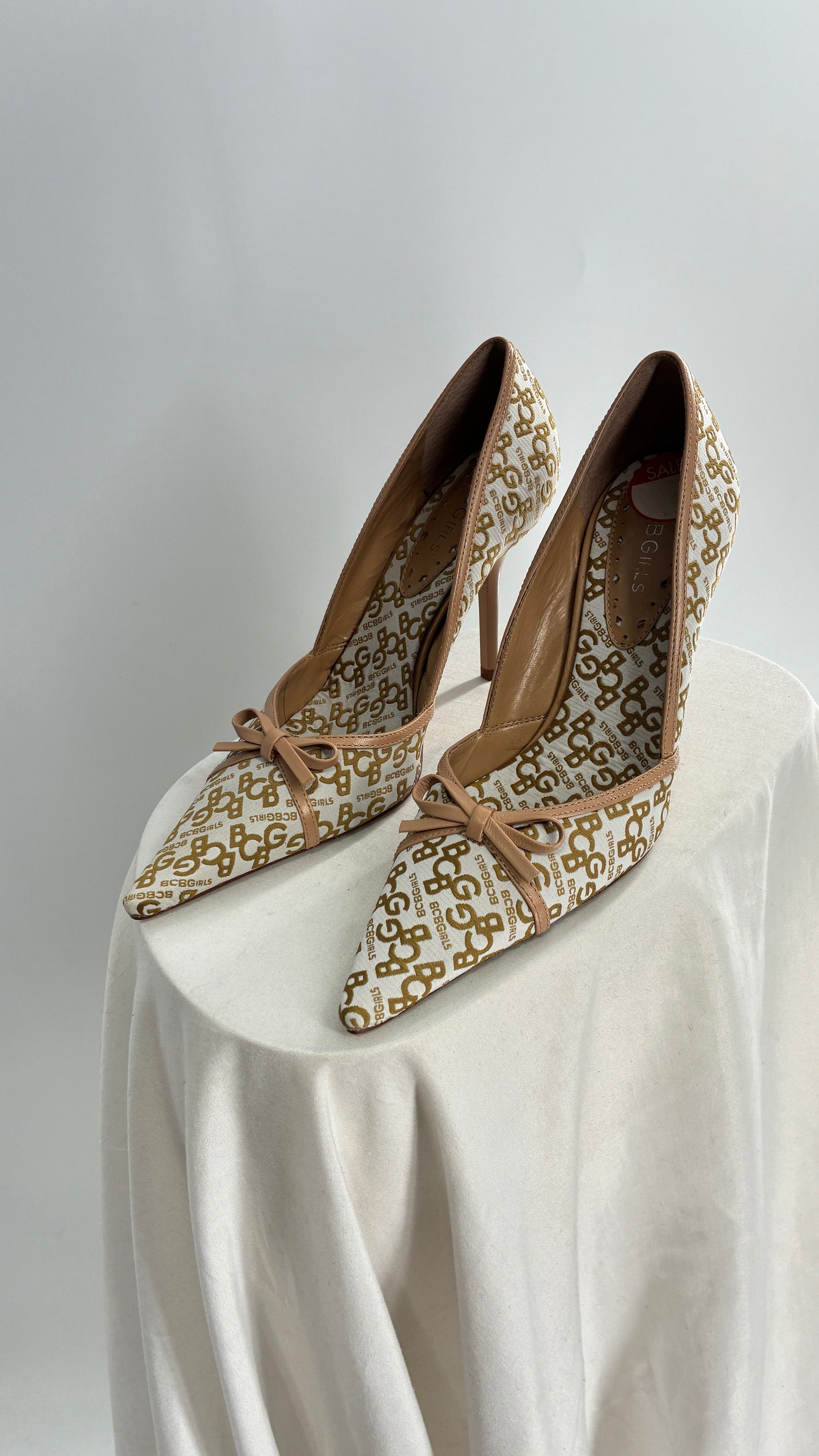 Vintage BCBG All Over Monogram Pointed Toe Heels with Leather Bows and Piping (5.5)