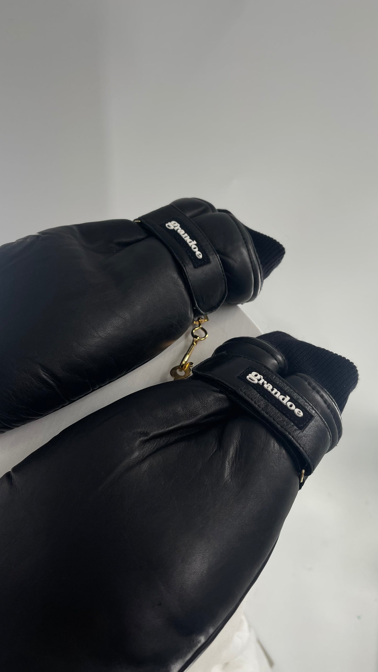 Grandoe Black Leather Mittens with Branding and Gold Logo Link