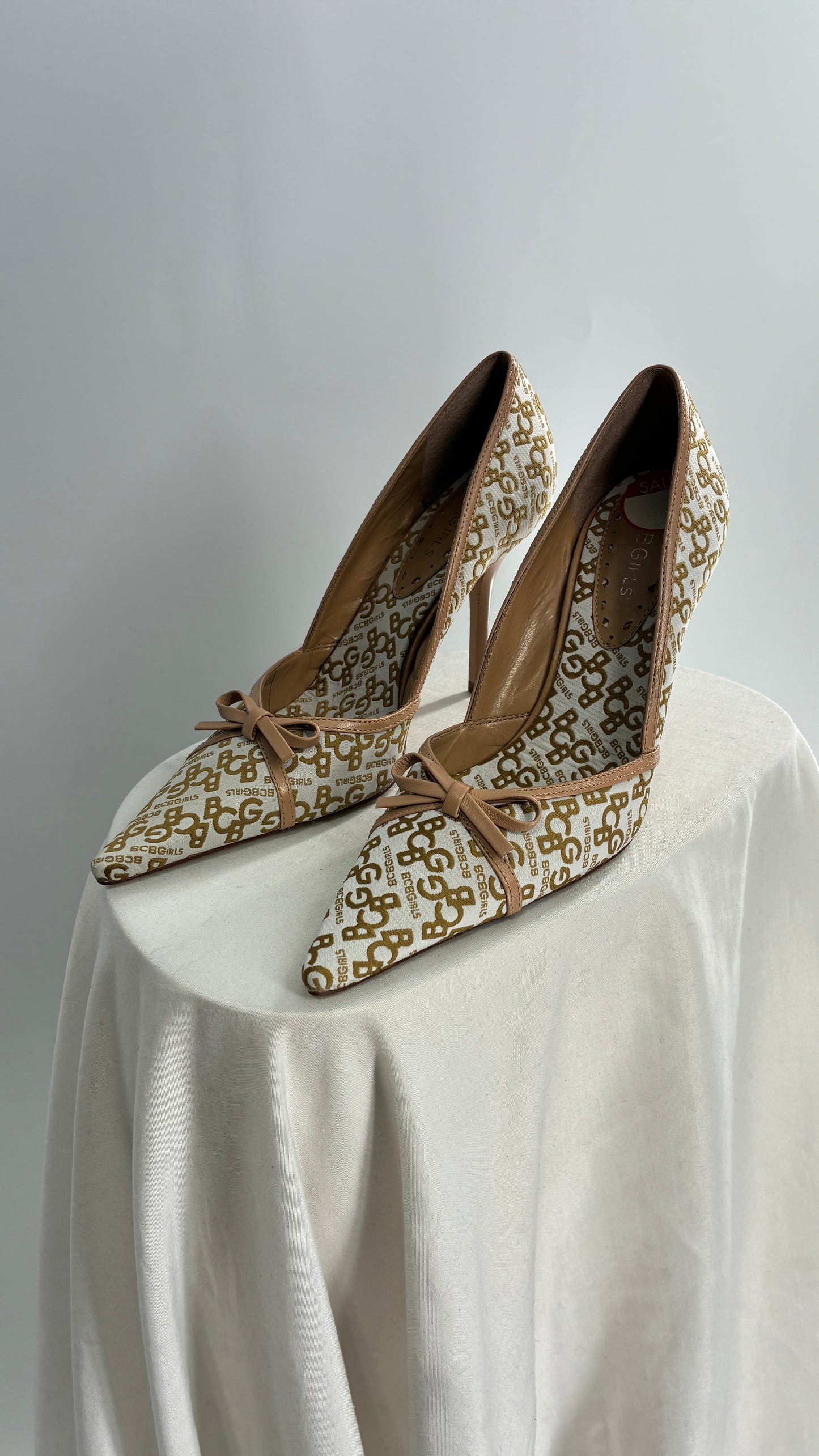 Vintage BCBG All Over Monogram Pointed Toe Heels with Leather Bows and Piping (5.5)