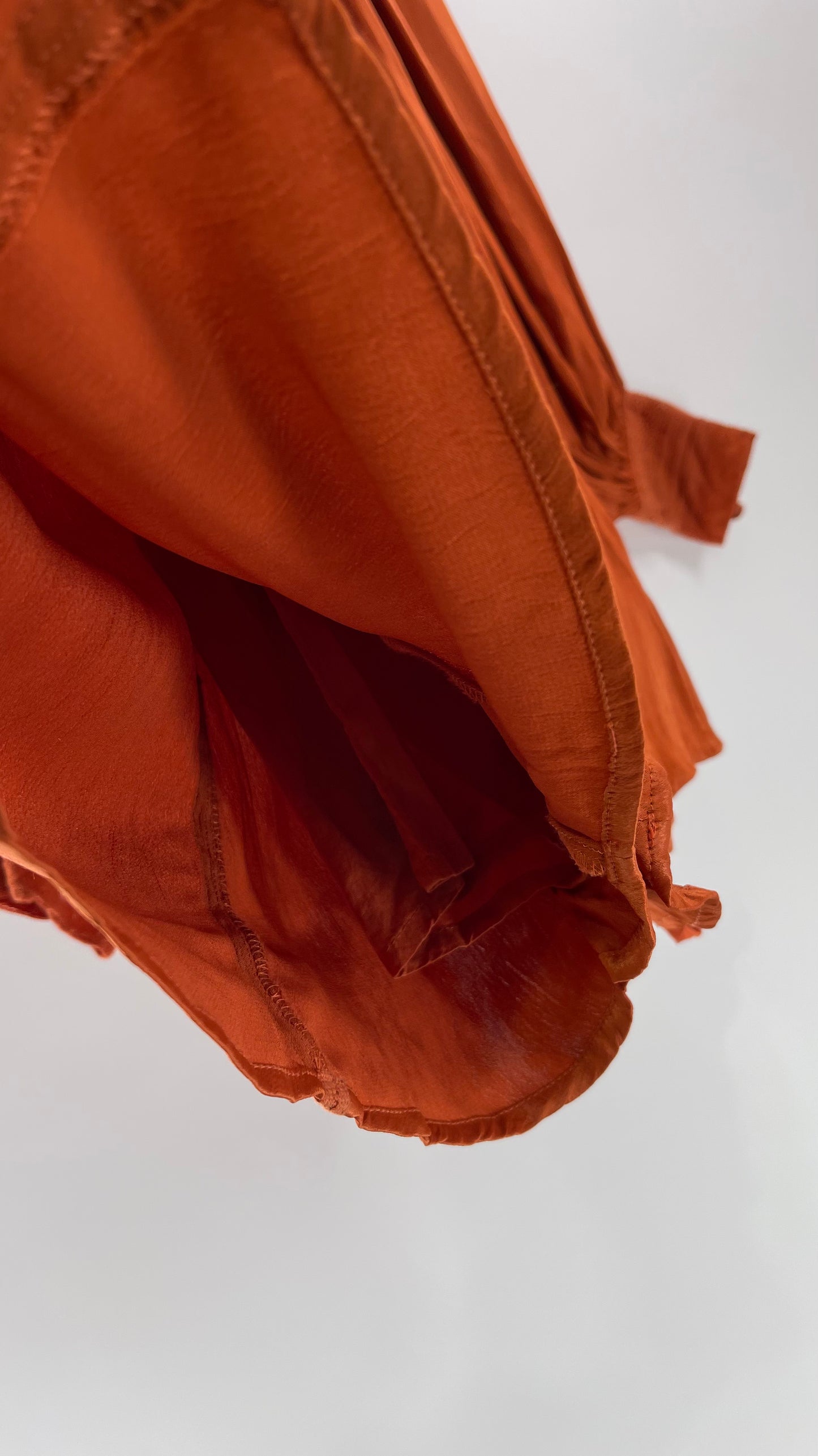 Free People Silky Orange Romper with Buttoned Sleeve Cuffs, Balloon Sleeves and Pleated Lace Bust (2)