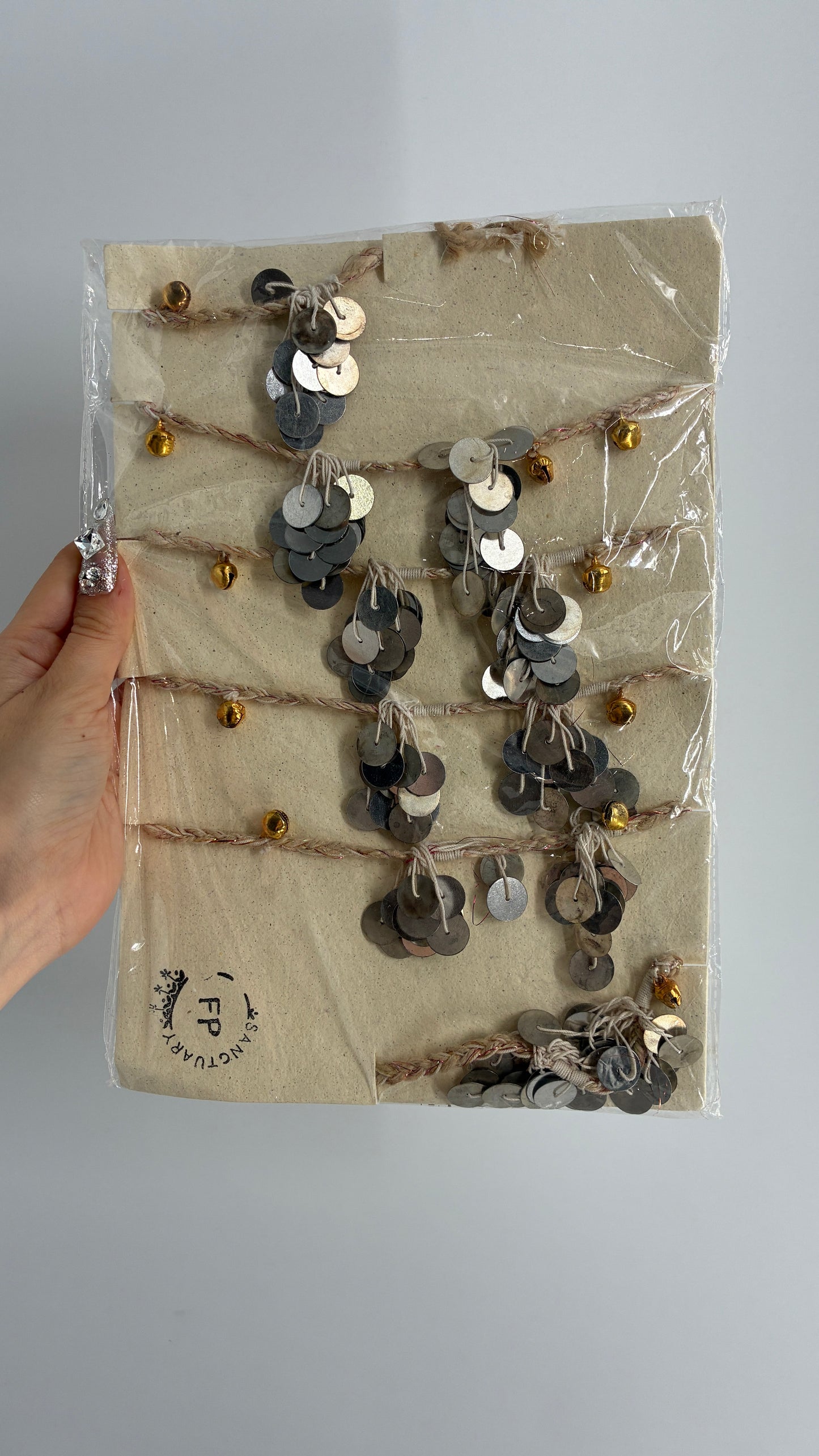 Free People Silver Metal Coin Garland with Gold Bell Detailing