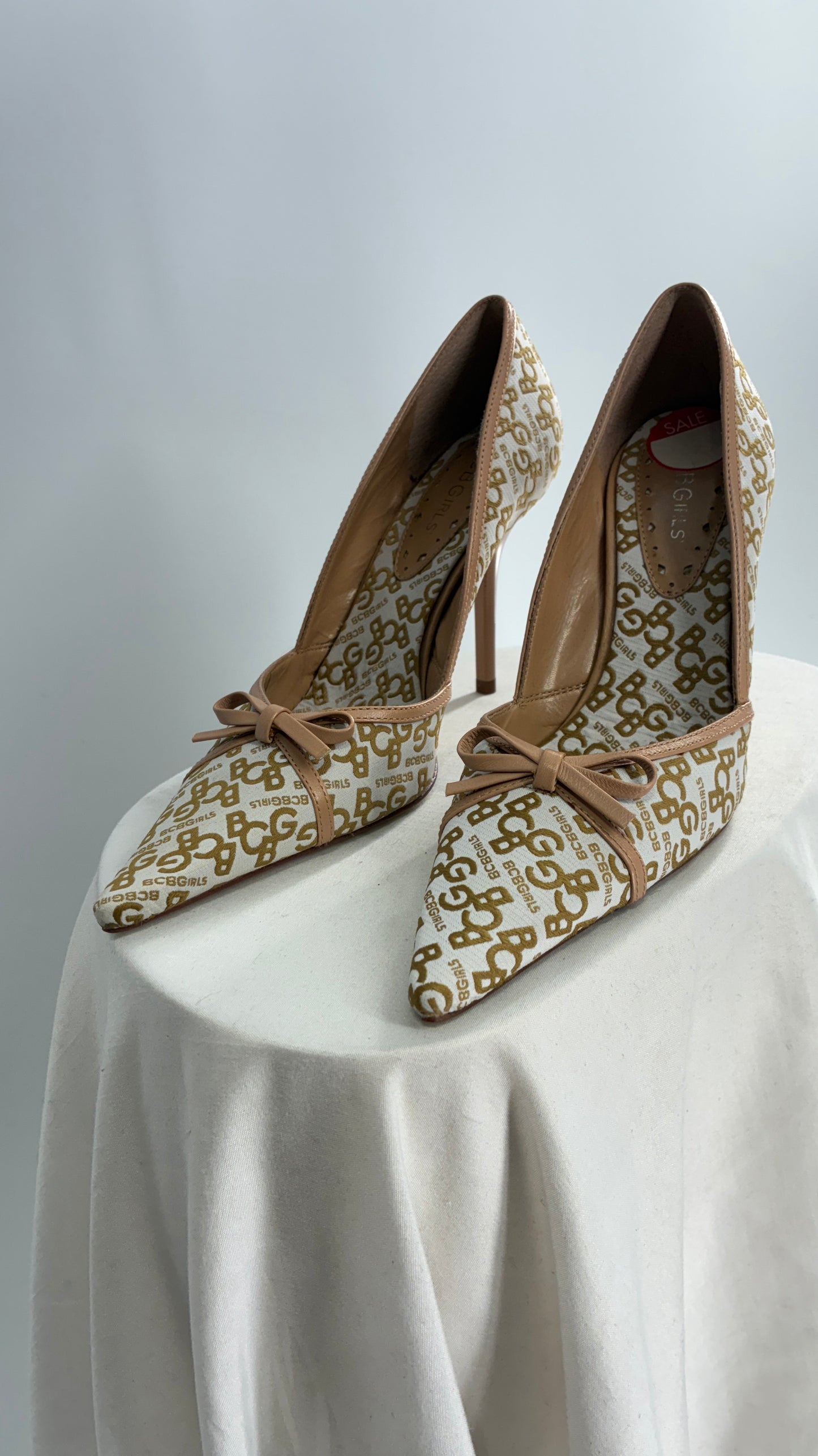 Vintage BCBG All Over Monogram Pointed Toe Heels with Leather Bows and Piping (5.5)