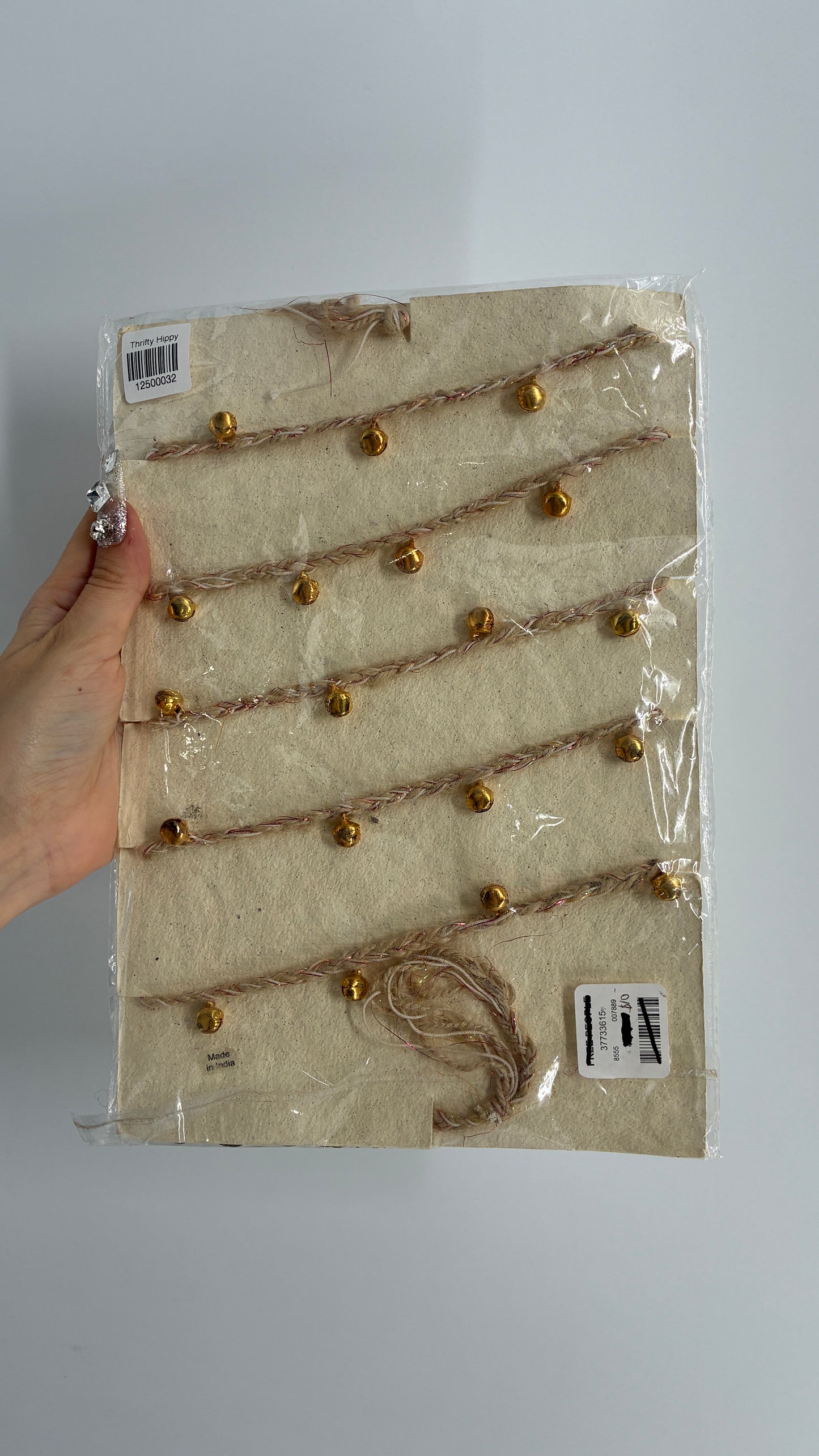 Free People Silver Metal Coin Garland with Gold Bell Detailing