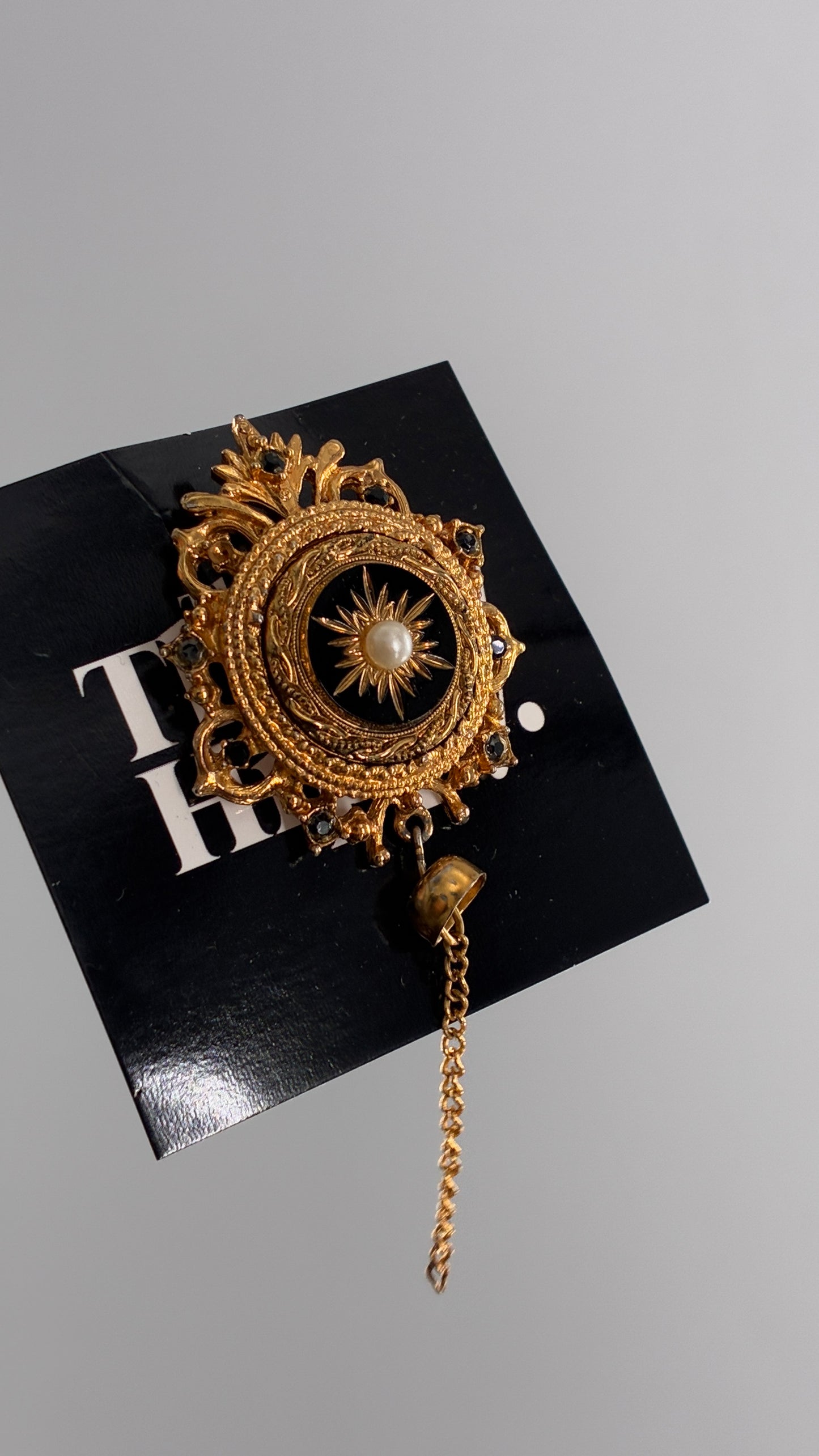 Vintage Victorian Revival Gold Brooch with Black Glass, Starburst Motif, Faux Pearl Centerpiece and Dangling Chain