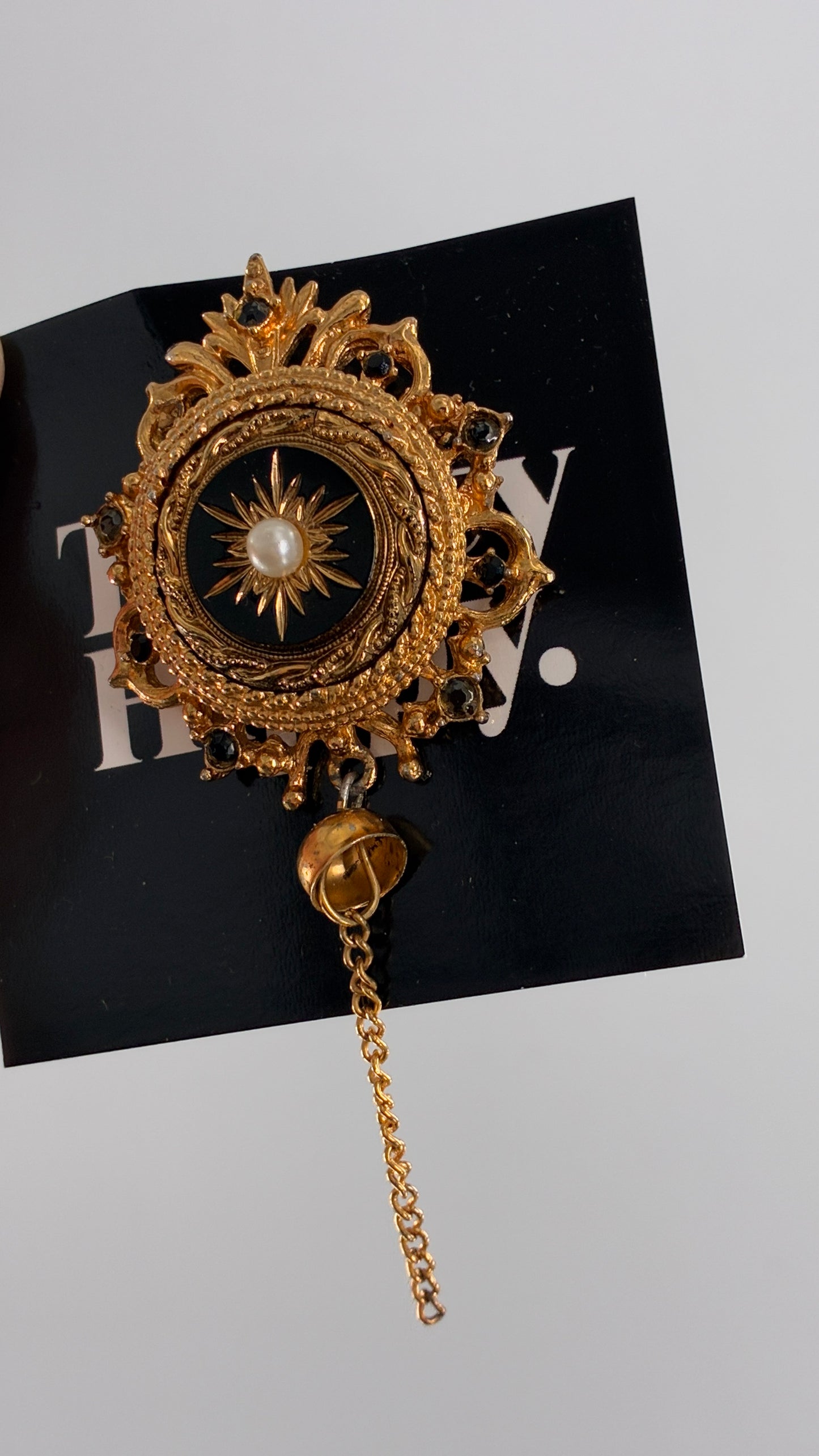 Vintage Victorian Revival Gold Brooch with Black Glass, Starburst Motif, Faux Pearl Centerpiece and Dangling Chain
