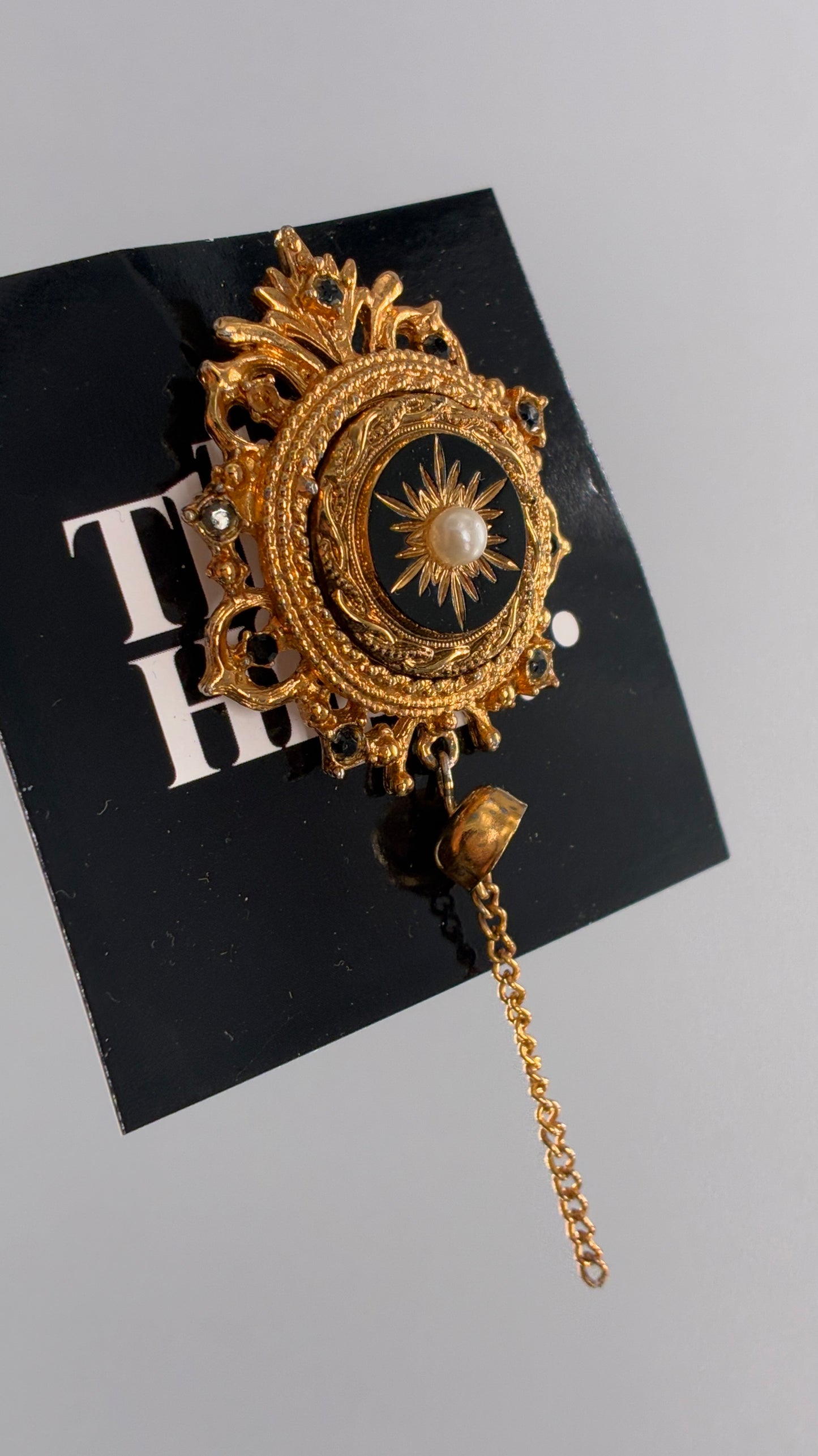 Vintage Victorian Revival Gold Brooch with Black Glass, Starburst Motif, Faux Pearl Centerpiece and Dangling Chain