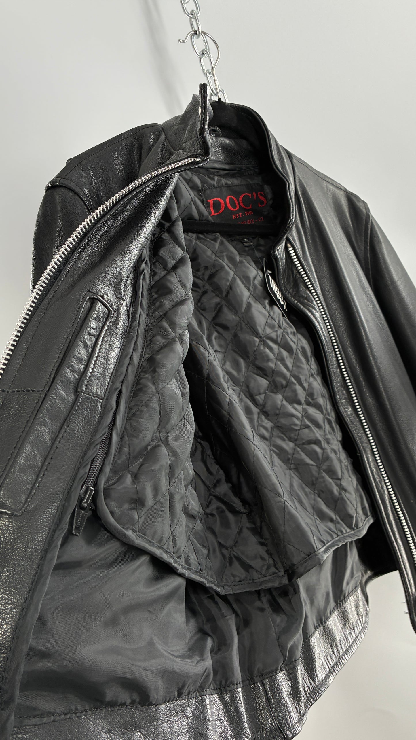 Vintage DOC’s Black Thick Leather Jacket with Removable Quilted Lining, Zippered Sides and Heavy Metal Details (Medium)