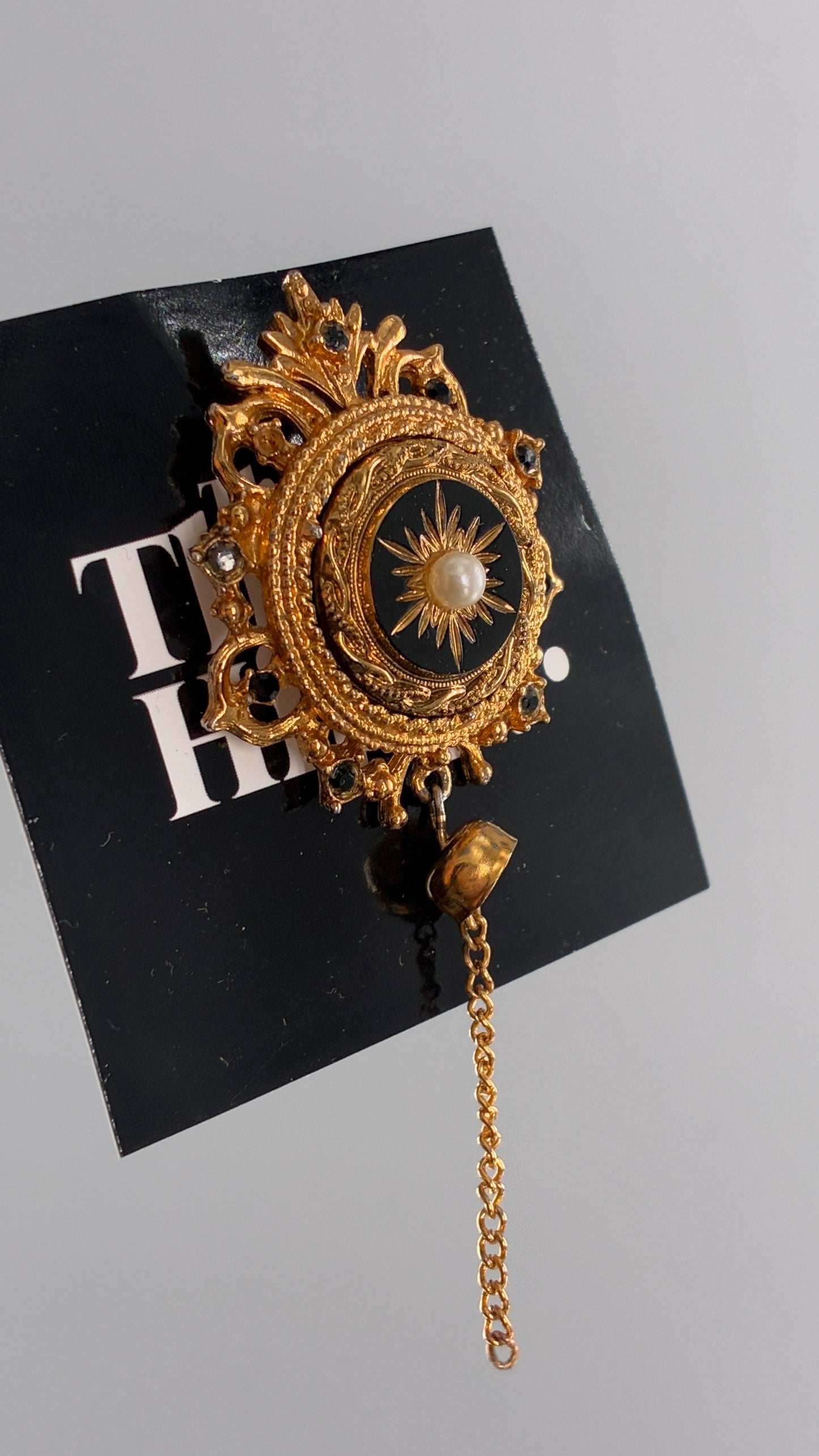 Vintage Victorian Revival Gold Brooch with Black Glass, Starburst Motif, Faux Pearl Centerpiece and Dangling Chain