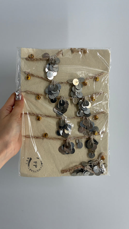 Free People Silver Metal Coin Garland with Gold Bell Detailing
