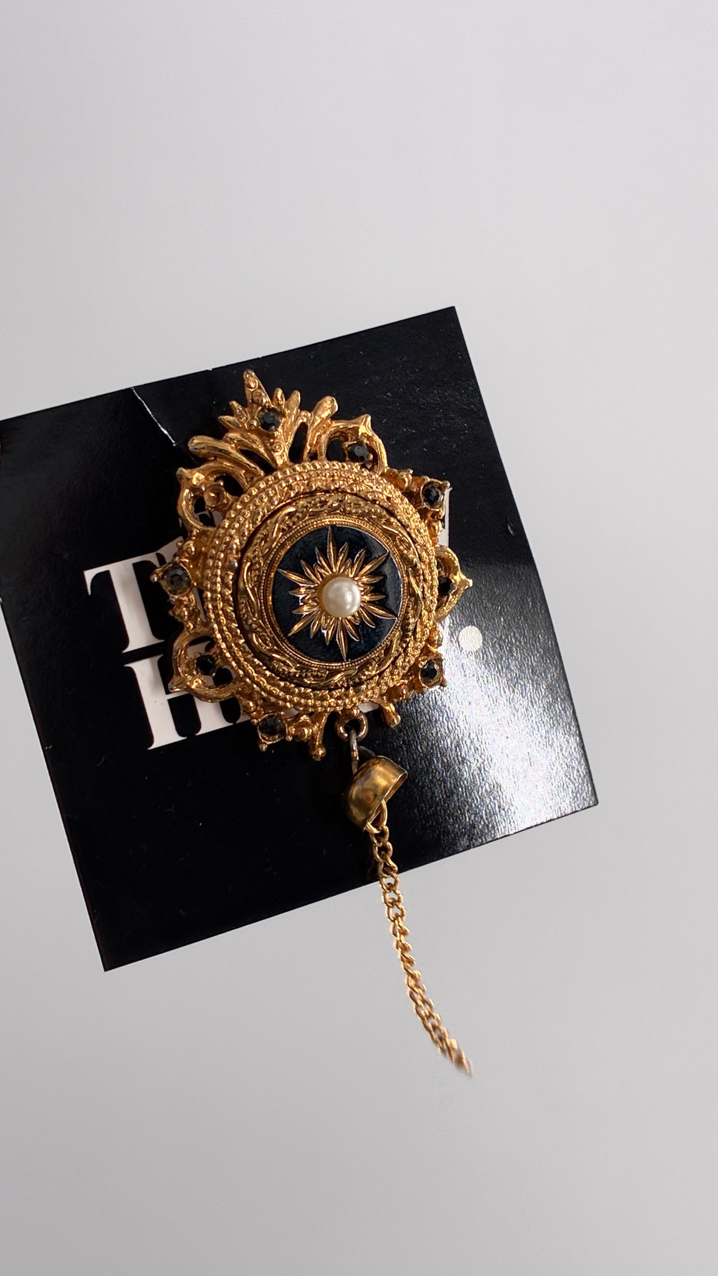 Vintage Victorian Revival Gold Brooch with Black Glass, Starburst Motif, Faux Pearl Centerpiece and Dangling Chain