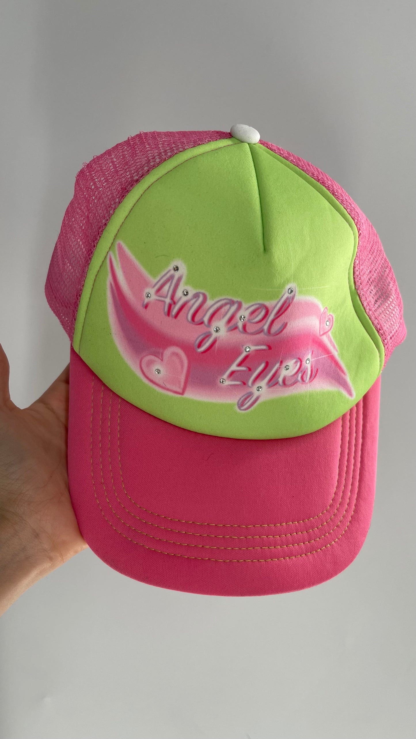 Angel Eyes Pink and Green Airbrush Trucker Hat