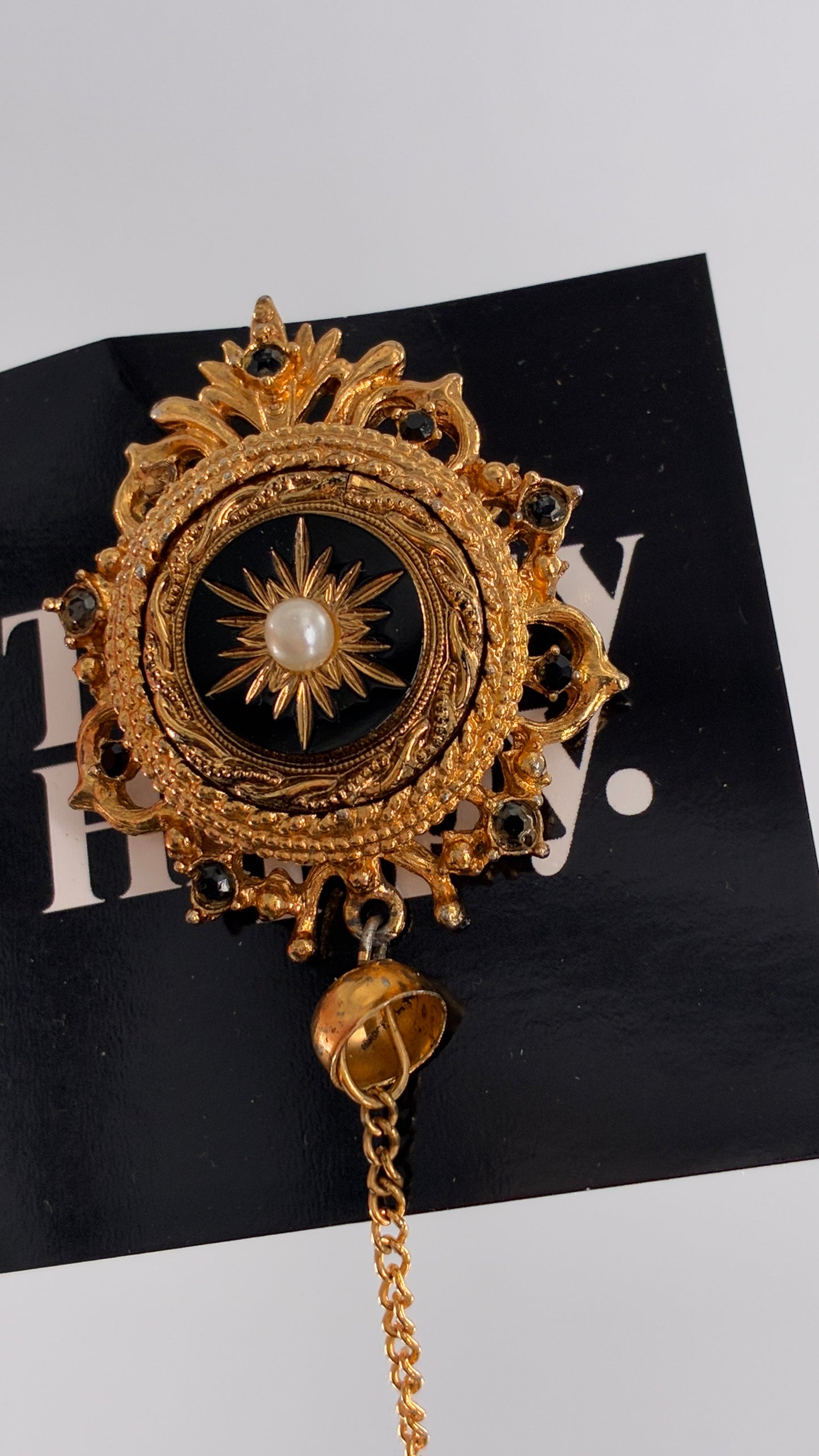 Vintage Victorian Revival Gold Brooch with Black Glass, Starburst Motif, Faux Pearl Centerpiece and Dangling Chain