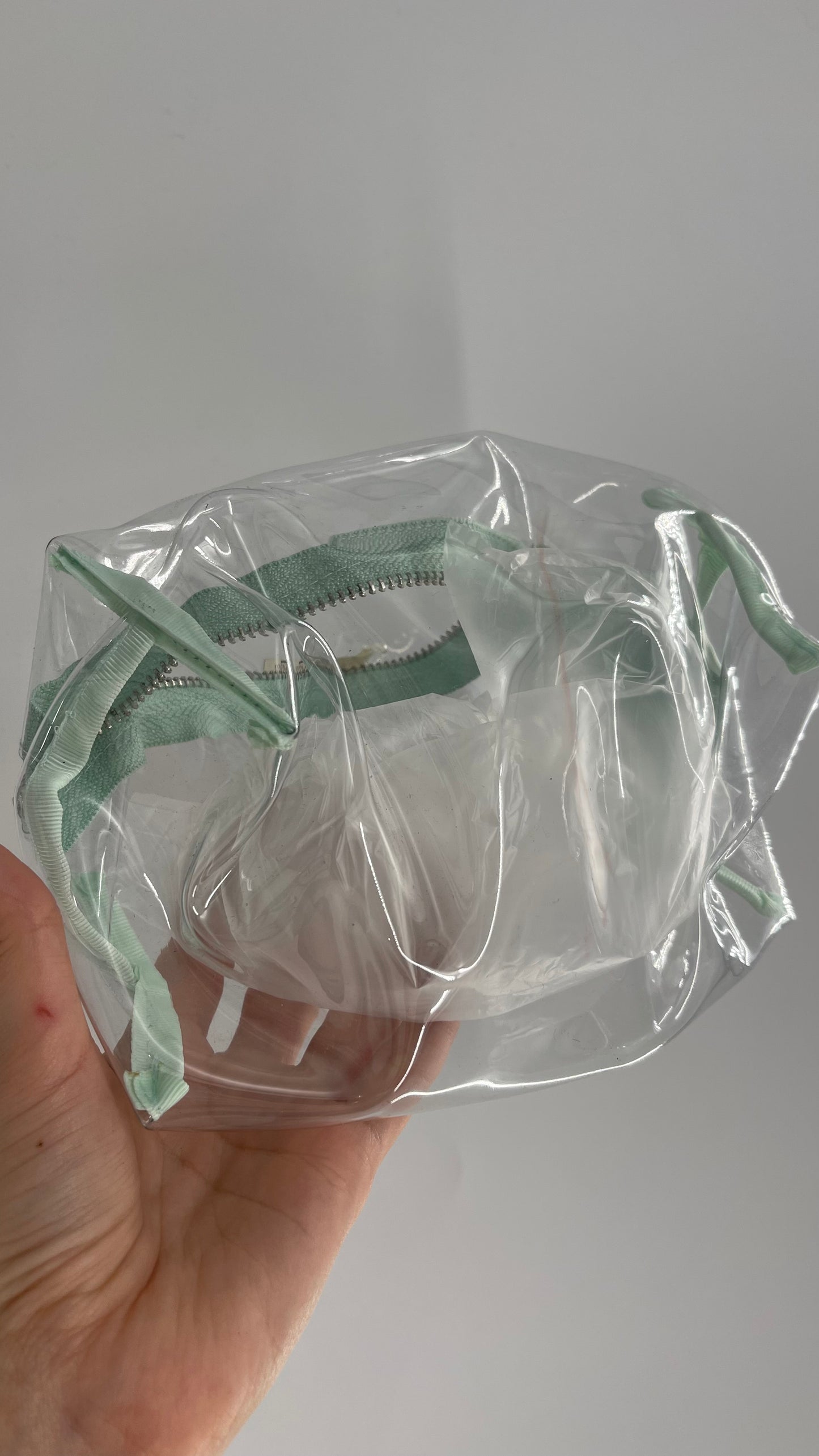 Clear Plastic Pouch with Teal Zipper Closure